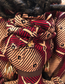 Handmade plastic bag holder doll Anaiah in African print dress with braided hairstyle and cowrie shell details