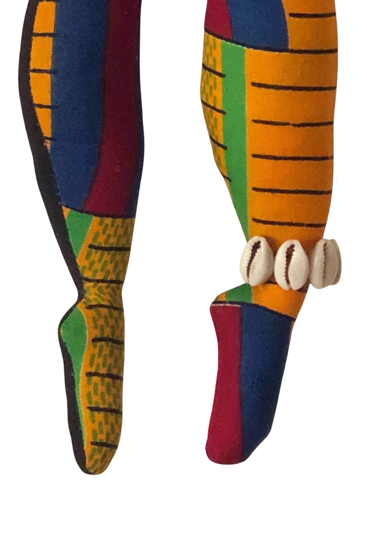Sekelaga Spirit Dancer doll dressed in vibrant Kente-inspired fabric with raffia skirt, cowrie shells, and colorful bead adornments.”