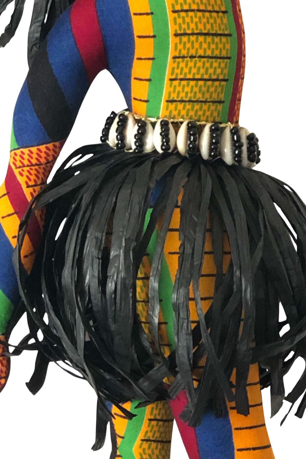 Sekelaga Spirit Dancer doll dressed in vibrant Kente-inspired fabric with raffia skirt, cowrie shells, and colorful bead adornments.”